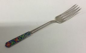 An early 20th Century silver and enamelled fork. B