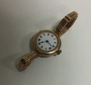 A 9 carat lady's wristwatch. Approx. 25 grams. Est