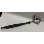 A Georgian silver toddy ladle with shaped rim. App