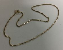 A 9 carat flat link chain. Approx. 3.1 grams. Est.