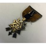 A Masonic silver badge in the form of a star. Appr
