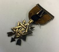 A Masonic silver badge in the form of a star. Appr
