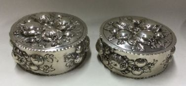 A pair of early German silver boxes embossed with