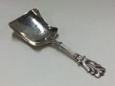 A Victorian silver caddy spoon with bright cut dec