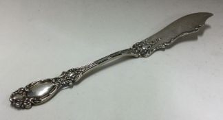 An American silver fish knife with chased handle.