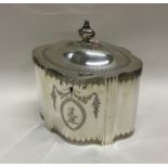 A Georgian silver tea caddy with engraved bright c