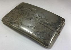 A large Japanese silver cigarette case decorated w