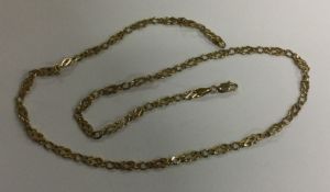 A 9 carat flat link chain. Approx. 8.9 grams. Est.