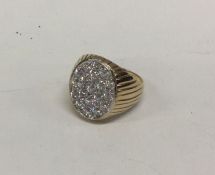 A large gold ring with stone mount. Approx. 8.9 gr