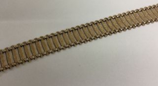 A fancy 9 carat mesh bracelet with concealed clasp