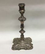A large 18th Century silver cast candlestick. Lond