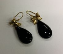 A pair of jet and gold mounted earrings. Approx. 1