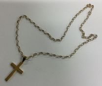 A 9 carat cross on oval link chain. Approx. 3.7 gr