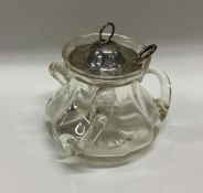 An Arts & Crafts glass preserve jar with silver li