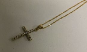 A good diamond cross mounted as a pendant on fine