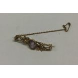 A 15 carat gold pearl and amethyst brooch. Approx.