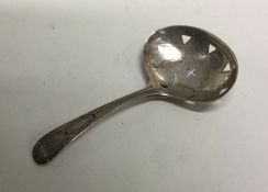 A George III silver caddy spoon with engraved and