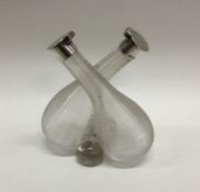 A silver mounted conjoined oil and vinegar bottle.