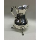 A Georgian style helmet shaped silver cream jug. L