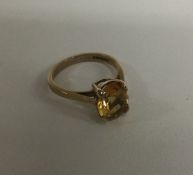 A 9 carat citrine single stone ring. Approx. 2.7 g