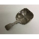 A silver caddy spoon with square bowl. Birmingham