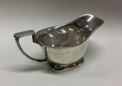 A good small Adams' style silver sauceboat on squa