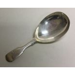 A silver fiddle pattern caddy spoon. London 1838.
