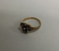 A garnet and pearl cluster ring with engraved deco