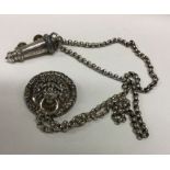 A silver Policeman's whistle on chain with lion ma