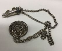 A silver Policeman's whistle on chain with lion ma