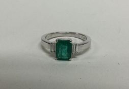 A stylish emerald and diamond five stone Art Deco