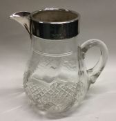 A silver mounted cut glass lemonade jug. Birmingha