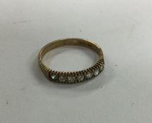 A 9 carat single row ring. Approx. 1.5 grams. Est.