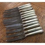 A set of six silver table knives together with six