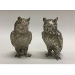 A heavy cast pair of silver owls. London 1994. By