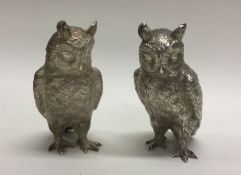 A heavy cast pair of silver owls. London 1994. By