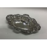 An Edwardian chased silver bonbon dish. Birmingham