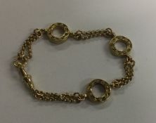 A fancy 9 carat bracelet with chased decoration. A