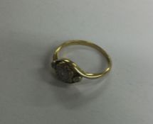 An 18 carat diamond cluster ring. Approx. 2.3 gram