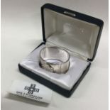 A cased silver Millennium napkin ring. London. App
