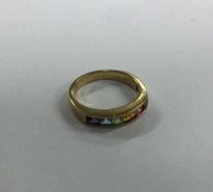 A 9 carat multi-stone set ring. Approx. 2.9 grams.