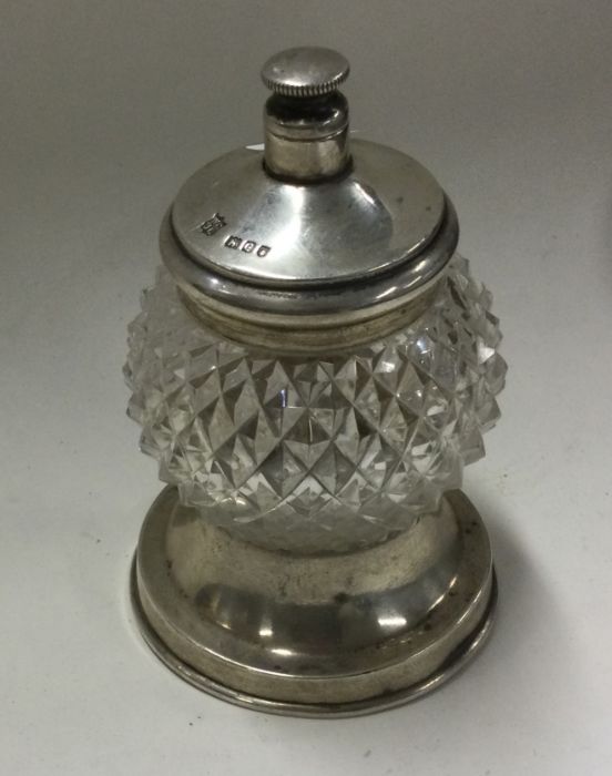 A silver and glass pepper grinder. London. Approx.