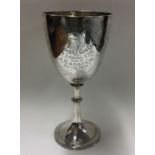 OF SHOOTING INTEREST: An engraved silver goblet. S