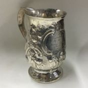 A George III chased silver mug. London 1813. By Jo