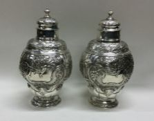 An 18th Century pair of silver tea caddies. London