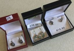 Three pairs of silver earrings. Est. £10 - £20.