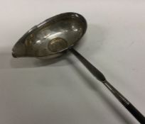A Georgian silver toddy ladle with whalebone handl