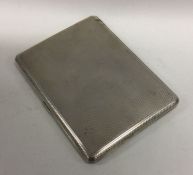 A heavy silver engine turned cigarette case. Appro