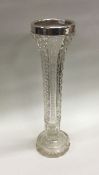 A tall silver mounted spill vase of fluted design.