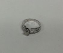 A large diamond single stone ring in claw mount wi